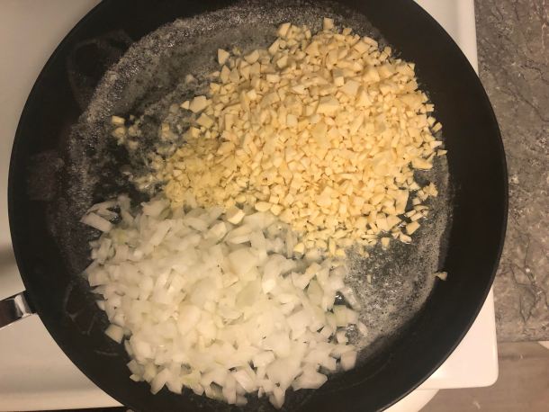 Cooking Eorzea | Adding in garlic, parsnips, and onions.