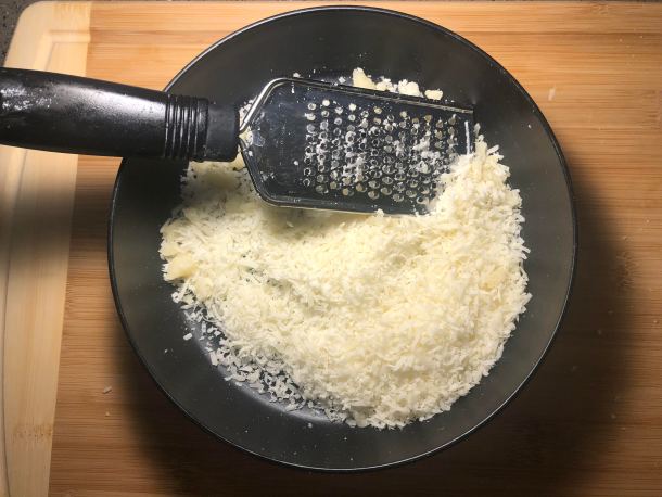 Cooking Eorzea | Shredding parmesan cheese. 